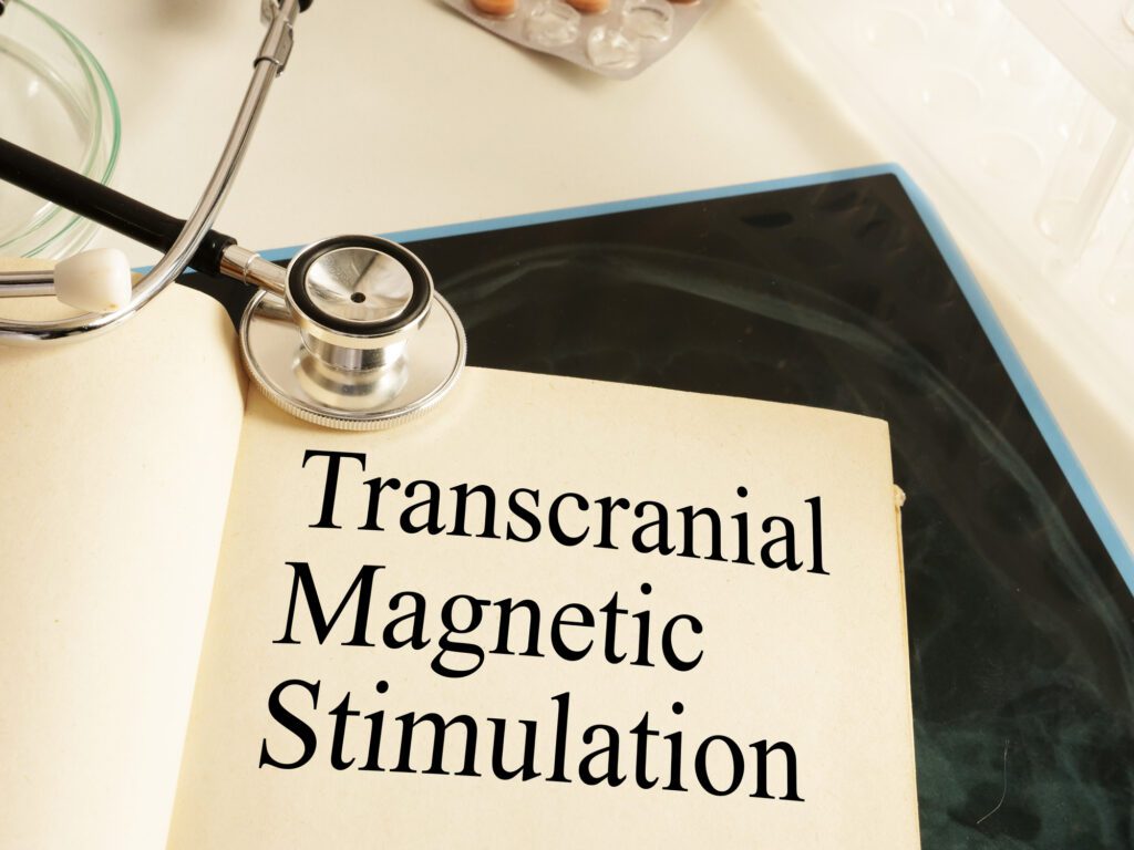 What is TMS? Transcranial Magnetic Stimulation TMS is shown on a photo using the text
